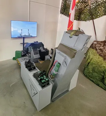 The simulator cockpit with TV in front